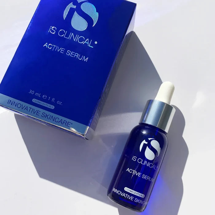 iS Clinical Active Serum blue glass dropper bottle next to matching blue box on white background