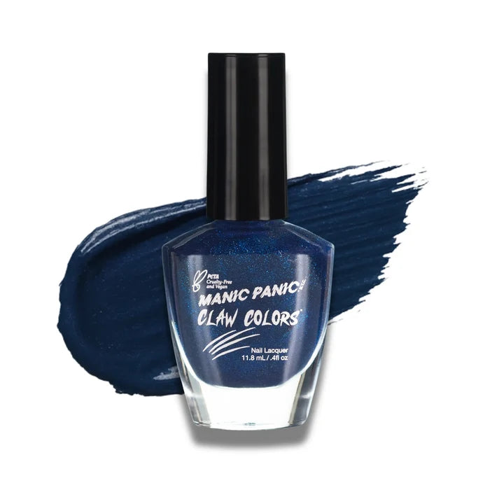 Manic Panic Claw Colors After Midnight glossy sapphire blue nail polish bottle with paint stroke background
