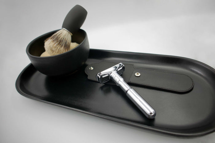 Safety razor with black leather pouch and shaving accessories