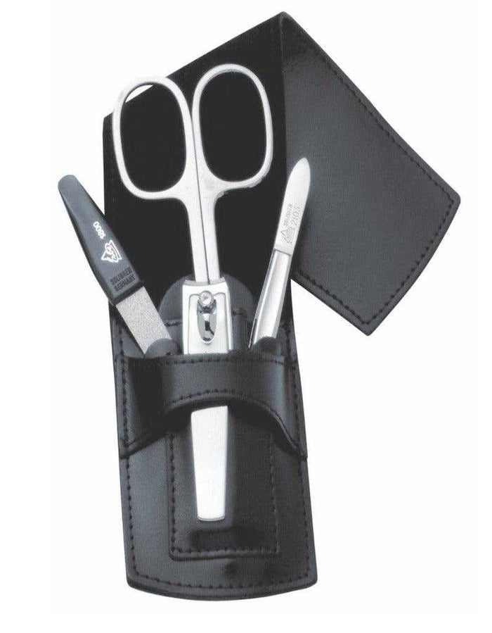 Black leather manicure set with scissors, tweezers, and nail clippers in a case