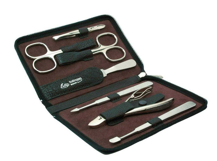 Manicure tools in leather case with scissors and nail clippers