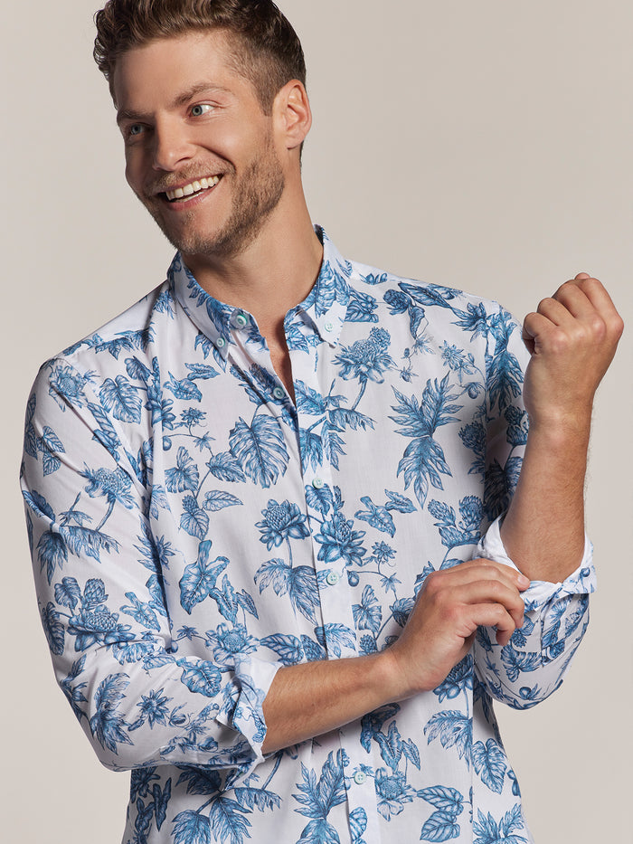 Blue and white floral-print long-sleeve shirt, man rolling up sleeve, front view (shown twice).