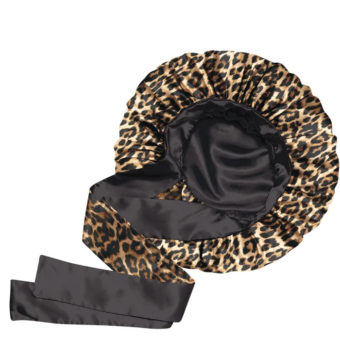 Leopard print bonnet with black satin lining on a white background