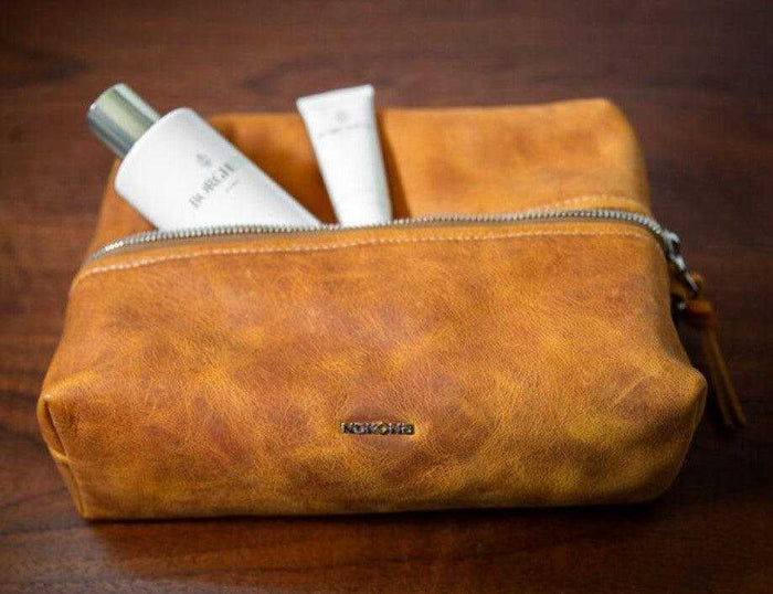 Nokona leather cosmetic bag with toiletries inside