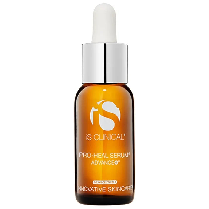 Amber glass dropper bottle of iS Clinical Pro-Heal Serum Advance+ with silver cap on white background