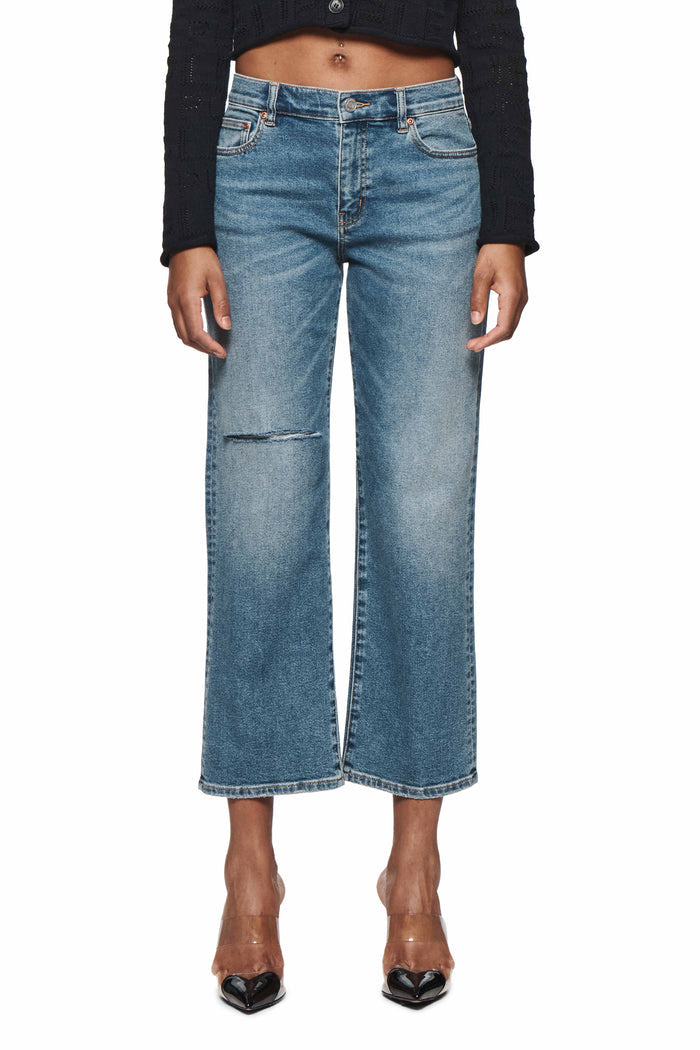 Slim Crop 80's denim in medium indigo wash with cropped straight leg and distressed details.