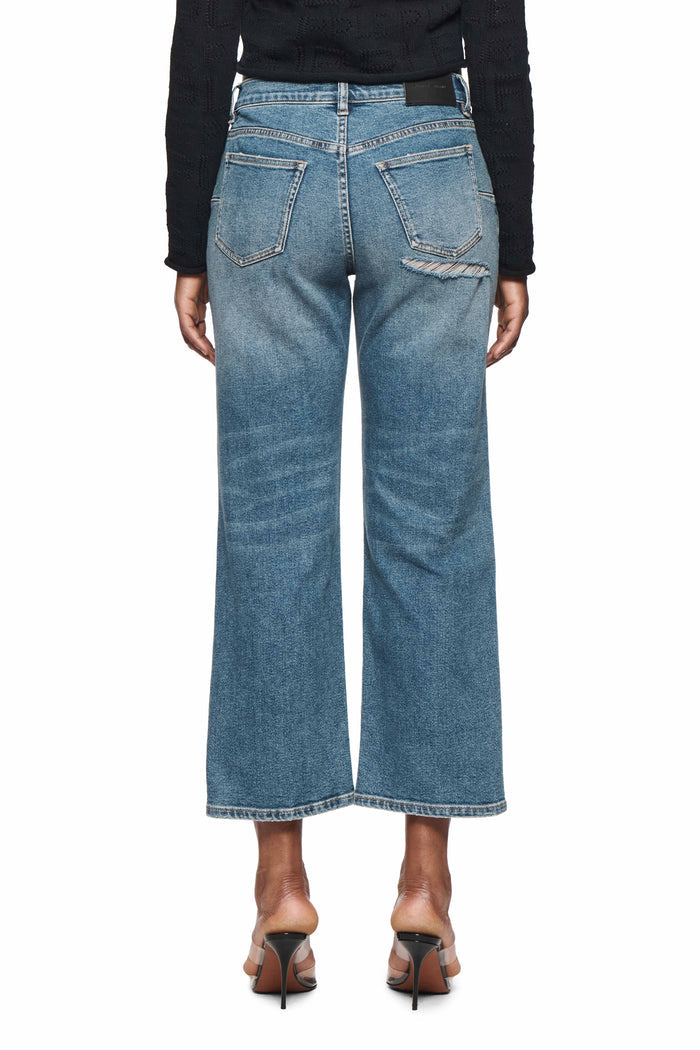 Slim Crop 80's distressed mid-rise denim with cropped straight leg and five pocket styling.