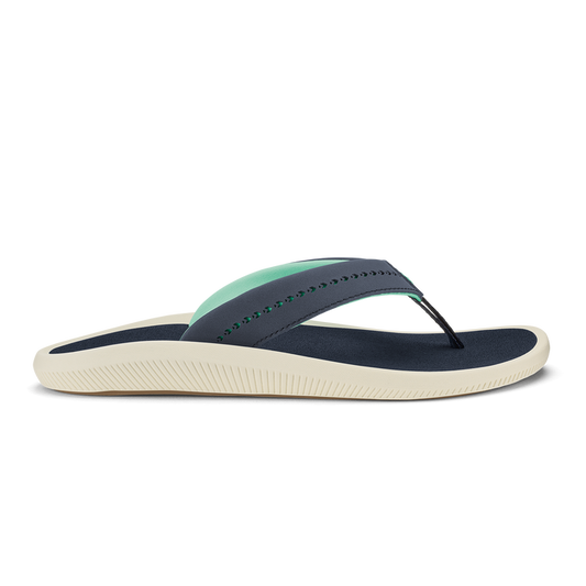 Trench blue thong sandal with mint green strap detail and cream-colored textured sole.