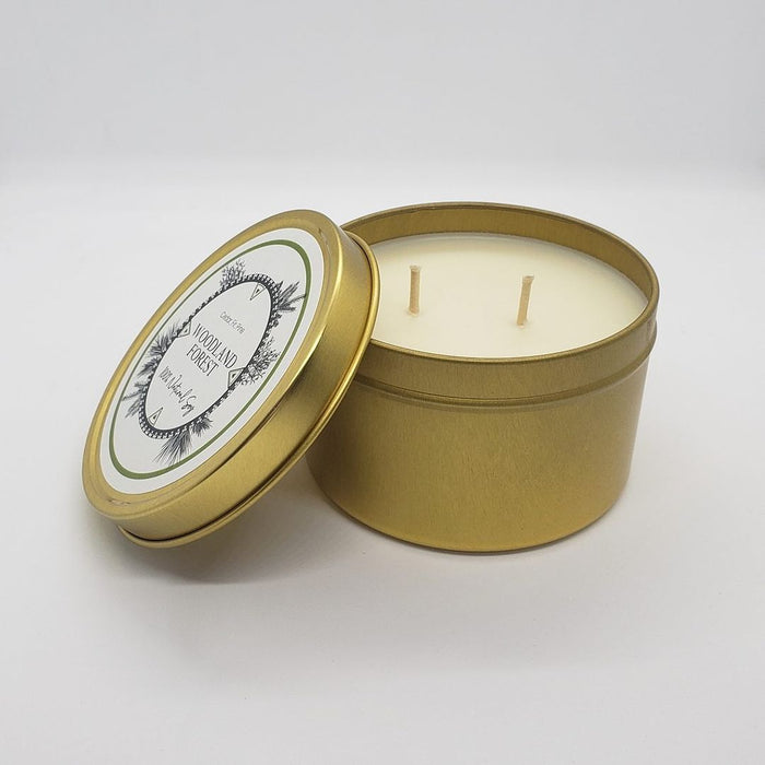 8oz travel tin in Woodland Forest, opened to show its two wicks.