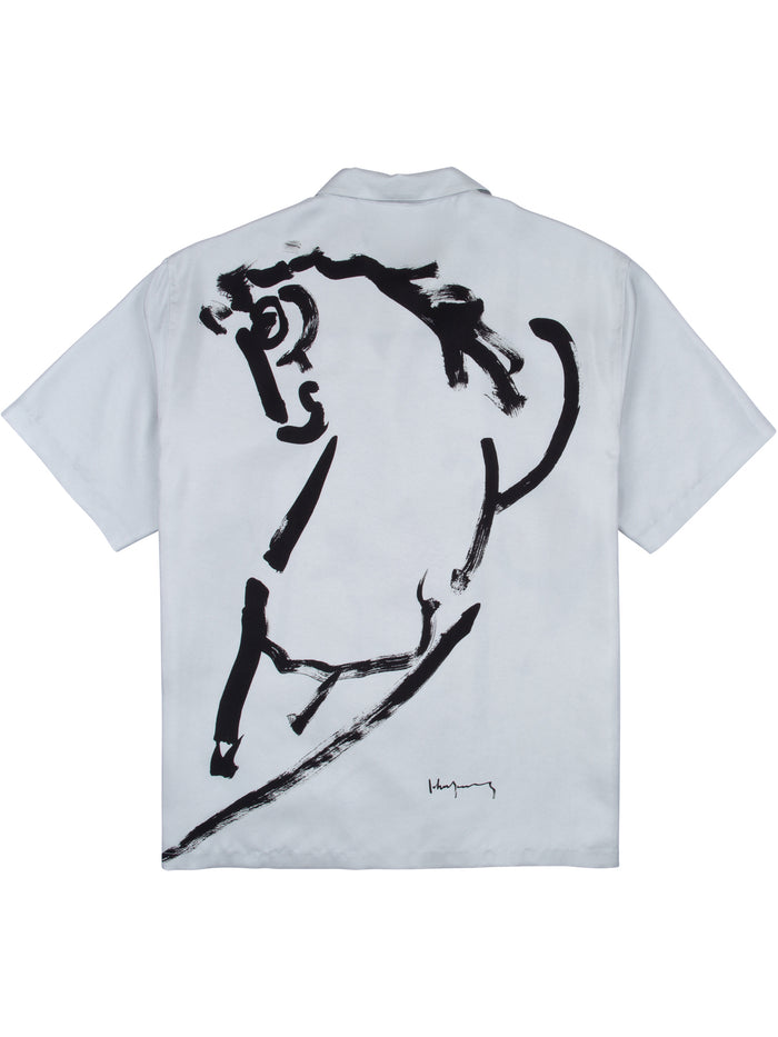 White shirt with abstract horse print/pattern, short sleeves, back view.